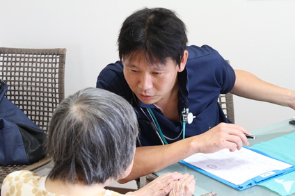 訪問先での仕事風景